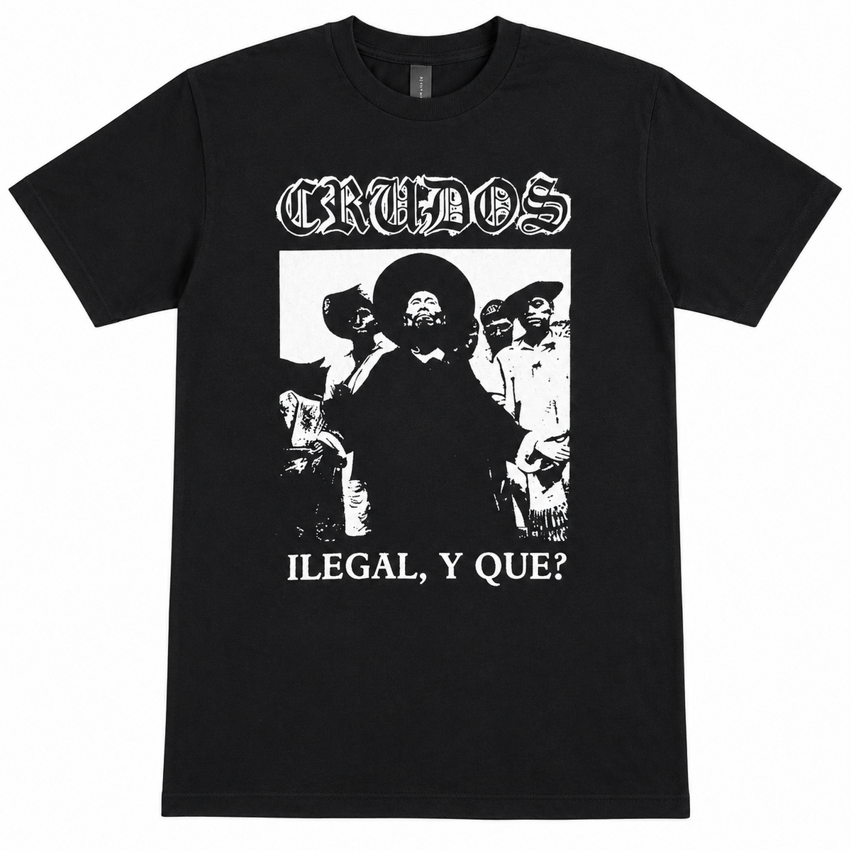 A black short-sleeve t-shirt with a white graphic print of the band Crudos. The print features the band's name in a gothic font at the top, a black-and-white photo of a man in a sombrero, and the text 'ILEGAL, Y QUE?' at the bottom.