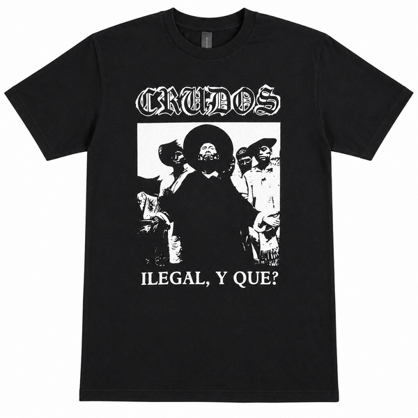 A black short-sleeve t-shirt with a white graphic print of the band Crudos. The print features the band's name in a gothic font at the top, a black-and-white photo of a man in a sombrero, and the text 'ILEGAL, Y QUE?' at the bottom.